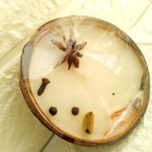 Aromatic Vanilla and Indian Spices-filled Candle in Coconut Shell, Full view